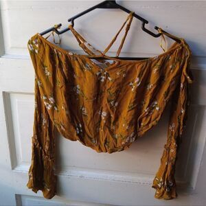 Rayon off-shoulder crop top. Elastic gathering at bottom & off shoulder sleeve